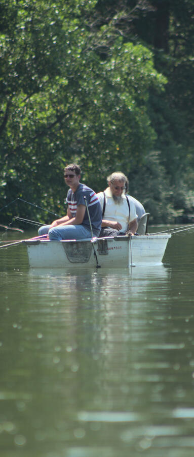 Simple pleasures under the toasty sun. I enjoy the differences in their facial expressions. I used a thin crop to have them crammed further together in the boat.